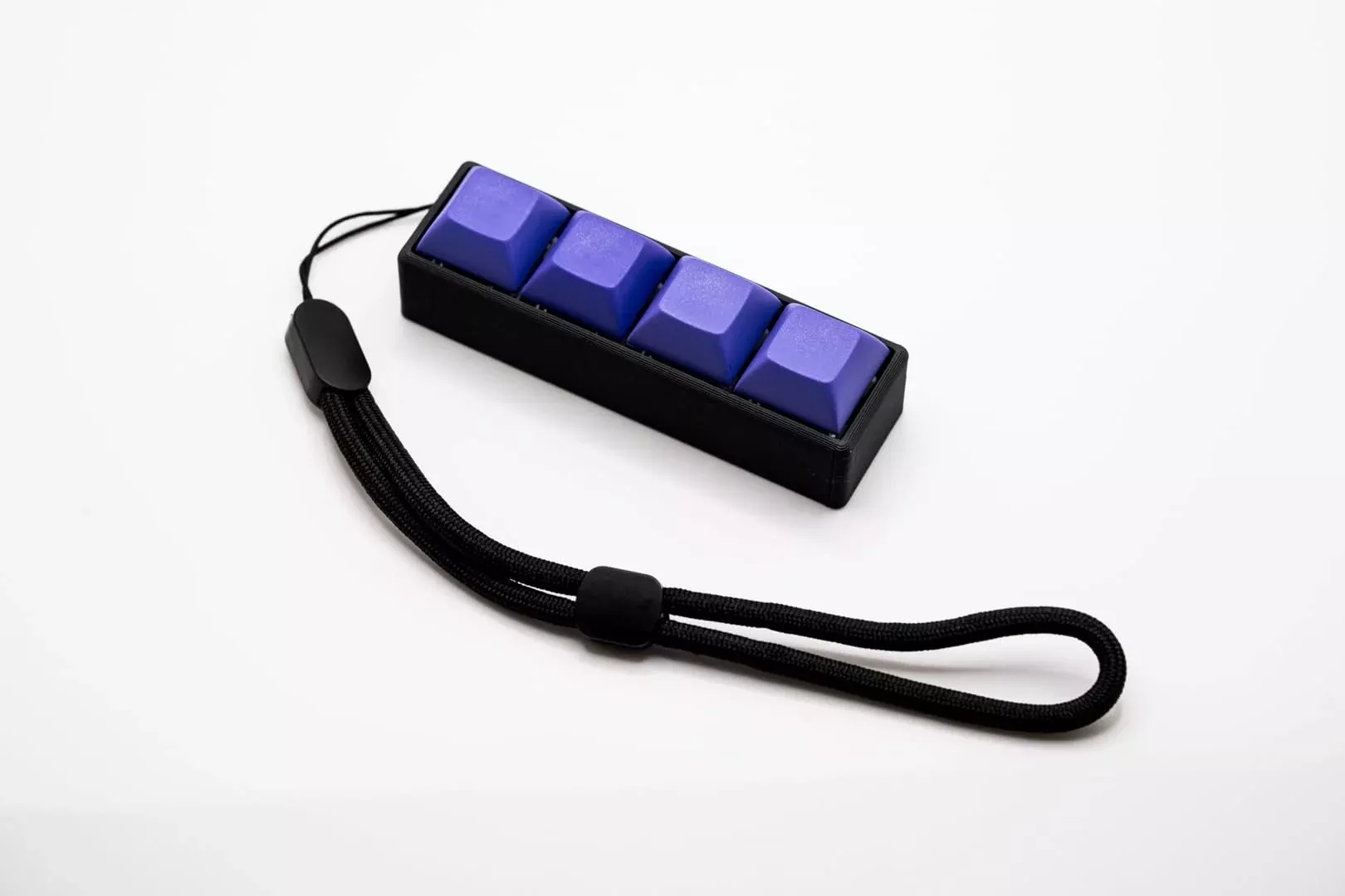 Zkeebs Four-Button Clicky Mechanical Switch Fidget Toy - Plastic, Purp